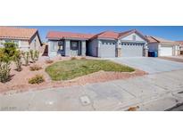 Charming single-story home with a well-manicured lawn and a spacious three-car garage, perfect for a Gathering at 1006 Blue Lantern Dr, Henderson, NV 89015