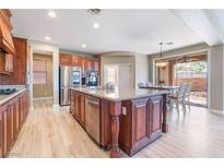 Spacious kitchen features a large center island, granite countertops, and stainless steel appliances at 1059 Via Saint Lucia Pl, Henderson, NV 89011