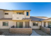 Charming townhome featuring a private front patio and neutral stucco exterior at 2050 Los Feliz St # 112, Las Vegas, NV 89156