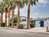 Charming single-story home featuring well-kept landscaping and striking palm trees at 2712 Royal St, North Las Vegas, NV 89030