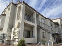 Three-story apartment building with a stucco exterior and metal balconies at 3318 N Decatur Blvd # 2057, Las Vegas, NV 89130