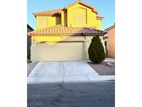 Charming two-story home featuring a two-car garage and a well-maintained front yard at 3438 Ceremony Dr, Las Vegas, NV 89117