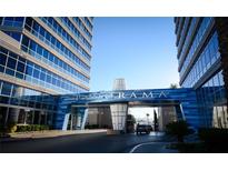 A striking entrance to the Panorama building, adorned with blue accents and sleek architectural design at 4515 Dean Martin Dr # 201, Las Vegas, NV 89103