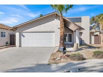 Charming single-story home with stucco siding, a two-car garage, and desert landscaping at 4809 Mountain Valley Rd, Las Vegas, NV 89121