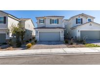 Charming two-story home featuring a two-car garage and manicured landscaping at 5382 El Nevero St, Las Vegas, NV 89166