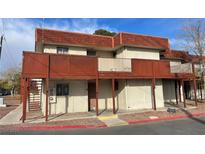 Two-story building featuring private balconies and a red roof at 5404 Swenson St # 34, Las Vegas, NV 89119