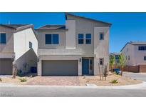 Charming two-story home with a two-car garage and a well-manicured front yard, perfect for suburban living at 10246 Bloom Quick Ct, Las Vegas, NV 89141