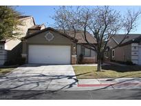 Charming one-story home features a well-maintained lawn and a two-car garage at 10321 Birch Bluff Ln, Las Vegas, NV 89145