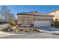 Charming single story home with desert landscaping, two car garage, and tile roof at 1045 Chestnut Chase St, Las Vegas, NV 89138