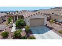 Charming single-story home with tile roof, desert landscaping, and inviting curb appeal at 2351 Thornwood Castle Dr, Laughlin, NV 89029