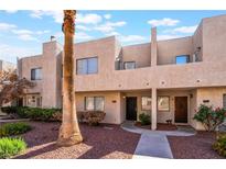 Charming townhouse featuring a stucco facade, desert landscaping, and a private entrance at 2667 Aracatuba Ave, Las Vegas, NV 89121