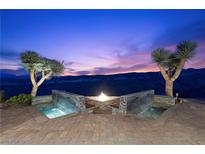 Stunning patio with a fire pit, water features and desert views at 37 Avenida Fiori, Henderson, NV 89011