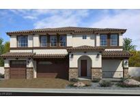 Two story home featuring desert landscaping, a tile roof, and a stone-clad garage and entry at 1918 Molly Brook Dr # Lot 5, North Las Vegas, NV 89084