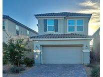 Charming two-story home with brick paved driveway and attached two-car garage at 2829 Mozia Ct, Henderson, NV 89044