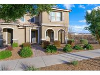 Charming two-story home with desert landscaping and covered entryway, shutters, and a tile roof at 2894 Via Firenze, Henderson, NV 89044