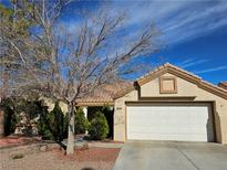 Charming single-story home featuring a two-car garage, well-maintained yard, and classic desert landscaping at 3104 Archwood Way, Las Vegas, NV 89134