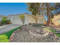 Charming single-story home featuring desert landscaping and a two-car garage at 3705 Covewick Dr, North Las Vegas, NV 89032