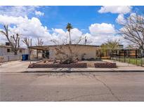 Charming single-story home featuring desert landscaping and a covered carport at 5125 Hallet Dr, Las Vegas, NV 89122