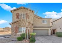 Charming two-story home boasts a stone facade, neutral paint, red shutters, desert landscaping, and a paver driveway at 7707 W Diablo Dr, Las Vegas, NV 89113