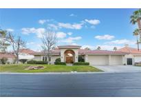 Charming single story home with well-manicured lawn and inviting red tile roof at 8701 Robinson Ridge Dr, Las Vegas, NV 89117