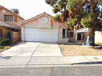 Charming single-story home with a two-car garage and a well-maintained front yard at 1253 Finale Ln, Las Vegas, NV 89119