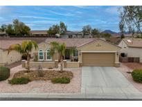 Charming single-story home with a two car garage and desert landscaping at 1616 Langston Hughes St, Henderson, NV 89052