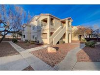 Inviting two-story condo with well-maintained landscaping and charming architectural details at 1881 W Alexander Rd # 1135, North Las Vegas, NV 89032