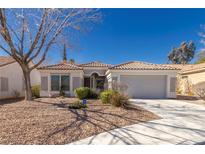 Charming single-story home with desert landscaping and a two-car garage at 1905 Sirocco Ct, Las Vegas, NV 89117