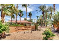 Exterior of Alexis Heights Condominiums featuring a sign and lush landscaping with palm trees at 5130 S Jones Blvd # 203, Las Vegas, NV 89118