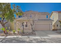 Charming two-story home with stone accents, a two-car garage, and desert landscaping at 8027 Anasazi Ranch Ave, Las Vegas, NV 89131