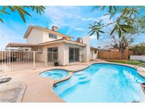 Backyard pool and spa with a covered patio and partial view of the home at 804 Vincent Way, Las Vegas, NV 89145