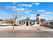 Charming single-story home featuring gravel landscaping and black trim at 1401 E Clark Ave, Las Vegas, NV 89101
