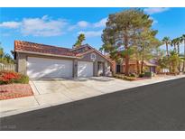 Charming single-story home with a two-car garage and well-manicured landscaping at 1808 Scenic Sunrise Dr, Las Vegas, NV 89117