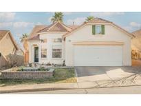 Charming single-Gathering home with a well-maintained lawn and attached two-car garage at 186 Shaded Peak St, Henderson, NV 89012