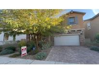 Charming two-story home featuring a two-car garage and well-maintained landscaping at 257 Homeward Way, Henderson, NV 89011