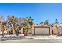 Charming single-story home with a well-maintained front yard and attached two-car garage at 427 Mindoro Ave, North Las Vegas, NV 89031