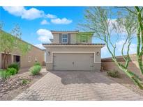 Charming two-story home with a welcoming facade and a spacious two-car garage at 8495 Green Alder Ct, Las Vegas, NV 89113