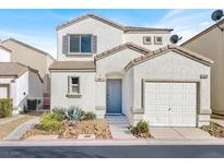Charming two-story home with a one-car garage, manicured yard, and neutral-toned exterior at 9920 Keephills St, Las Vegas, NV 89183