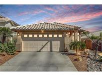 Charming single-story home featuring a two-car garage and beautifully landscaped desert-style front yard at 10532 Beachwalk Pl, Las Vegas, NV 89144