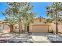 Charming single-story home featuring mature trees and a two-car garage at 1101 Coral Desert Drive, Las Vegas, NV 89123
