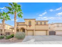 Charming two-story home with desert landscaping, two-car garage, and barrel tile roof at 3213 Salutare Ct, North Las Vegas, NV 89031