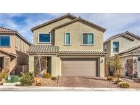 Charming two-story home with neutral stucco, a brick driveway, and a well-maintained front yard at 4364 Contour Bend Ave, North Las Vegas, NV 89084