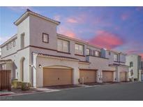 Charming townhome featuring a private two-car garage and well-maintained stucco exterior in a desirable community at 1040 Via Panfilo Ave, Henderson, NV 89011