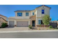 Charming two-story home featuring a three-car garage and desert landscaping at 3356 Dalmore St, Henderson, NV 89044