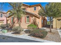 Charming two-story home with a desert landscape, shutters, and an attached garage at 3558 Harbor Tides St, Las Vegas, NV 89147