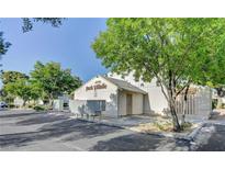 Park Village community building with mature shade tree and parking area at 4770 Topaz St # 31, Las Vegas, NV 89121