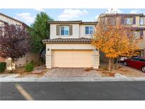 Charming two-story home with a two-car garage and a well-maintained front yard at 7253 Sterling Rock Ave, Las Vegas, NV 89178