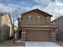 Charming two-story home with a two-car garage, appealing facade, and well-maintained landscaping at 8683 Bella Jewel Ave, Las Vegas, NV 89178