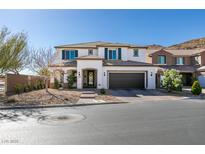 Charming two-story home features a well-manicured front yard and an attached two-car garage at 9519 Chandler Springs Ave, Las Vegas, NV 89148