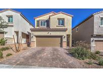 Charming two-story home with a paved driveway and well-maintained landscaping, boasting a warm and inviting curb appeal at 10590 Dryades Ave, Las Vegas, NV 89166